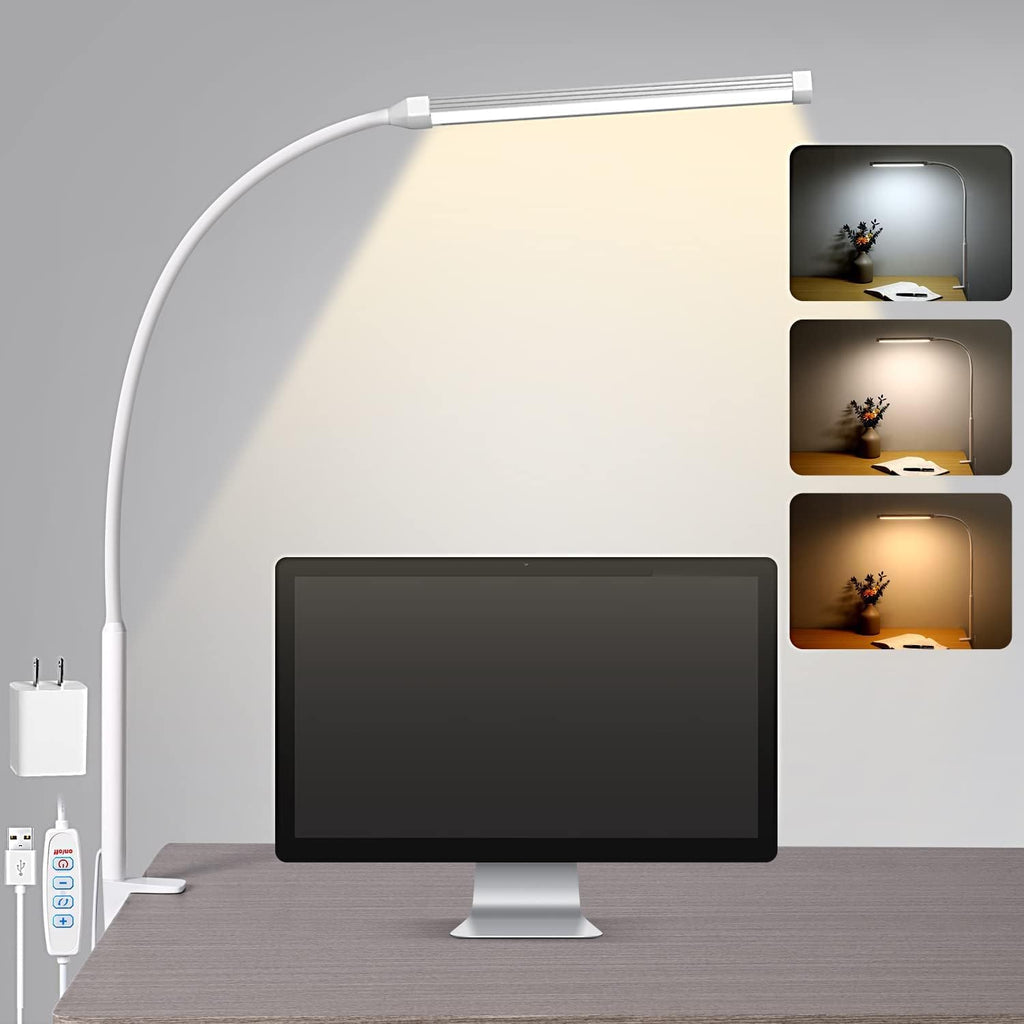 Clip on LED desk lamp with flexible neck clamped to a desk lighting an open book