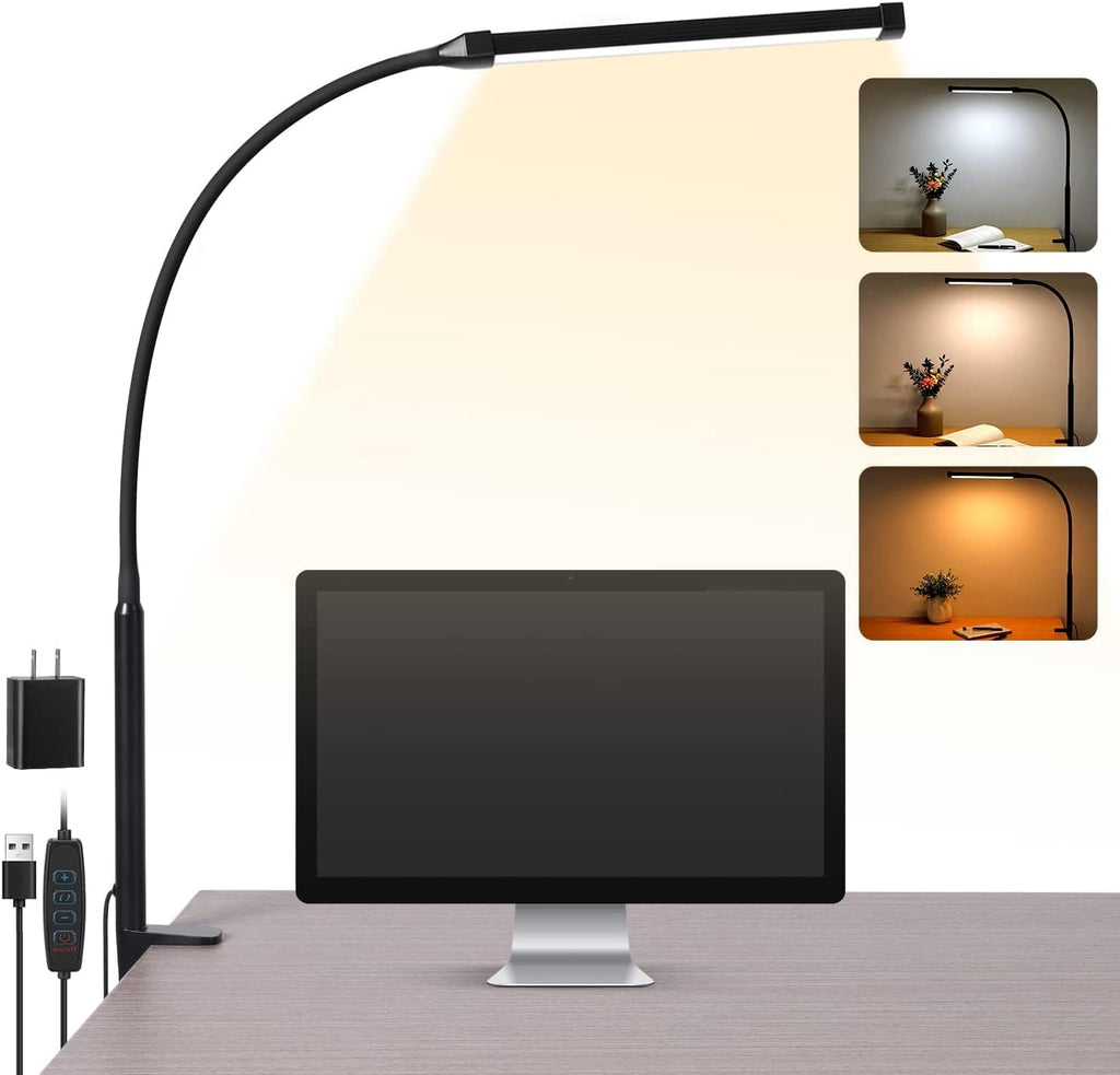 Clip on LED desk lamp with flexible neck clamped to a desk lighting an open book