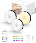RGB under cabinet puck lights glowing in color under a kitchen shelf and display case