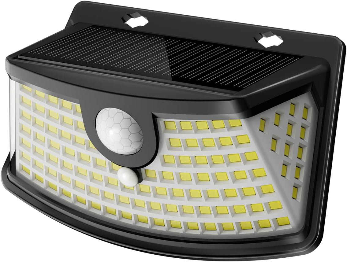 Solar motion sensor lights outdoor mounted on a house wall lighting a front step at night