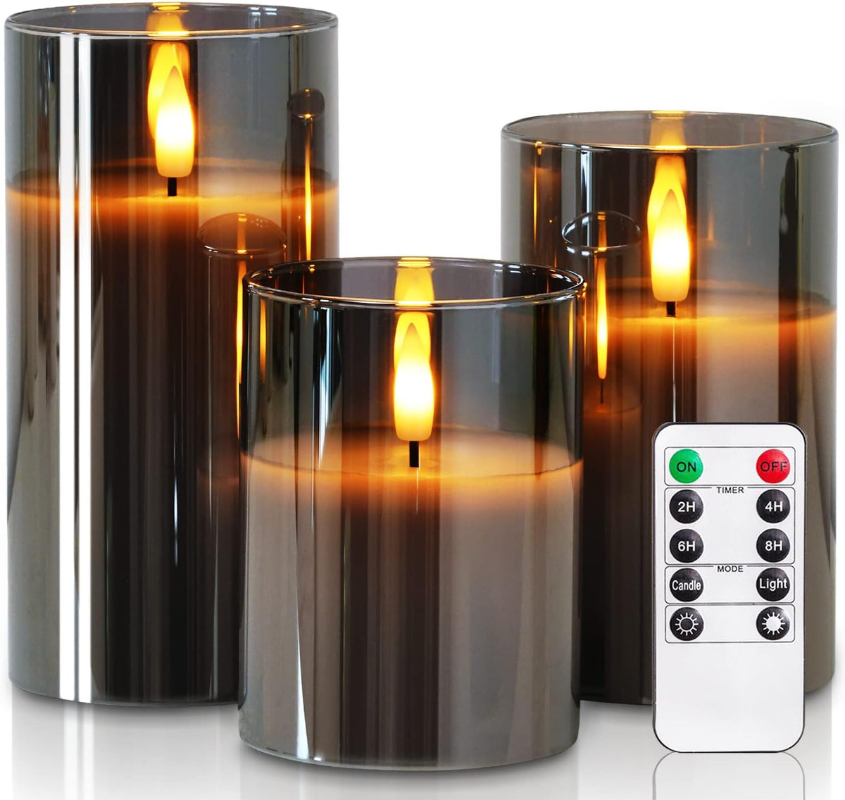 Flameless candles in grey glass holders flickering on a mantel as seasonal decor
