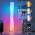 RGB corner floor lamp with hourglass shade glowing purple in a gaming room corner