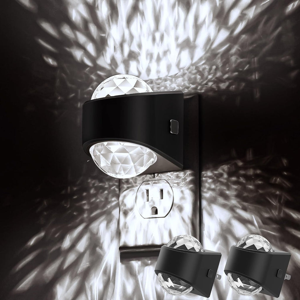 Plug in projector night light casting a soft white glow across a dark bedroom wall