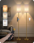 Dimmable floor lamp with fabric shade lighting a living room corner beside a chair
