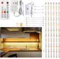 Under cabinet LED strip light kit casting warm white light across a kitchen counter