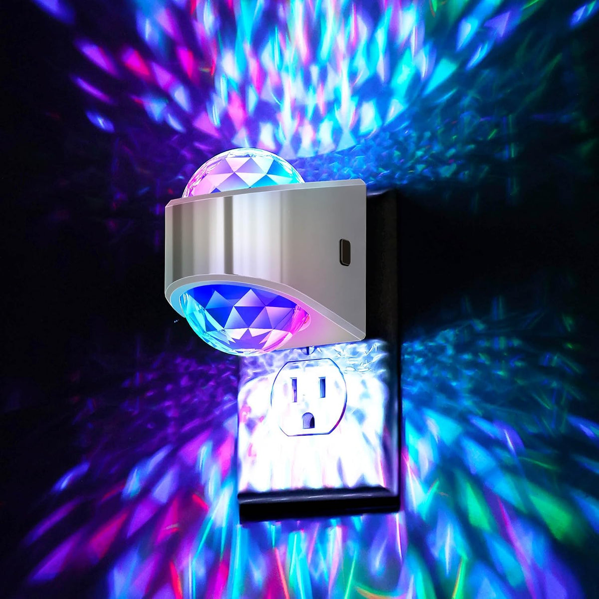 Plug in projector night light casting a soft white glow across a dark bedroom wall