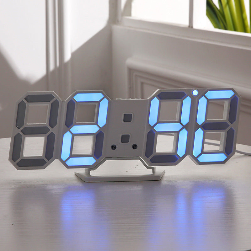 3D LED wall clock displaying blue digits on a windowsill