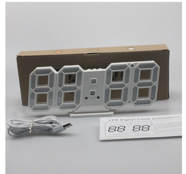 3D LED wall clock shown with its box, USB cable and instruction sheet