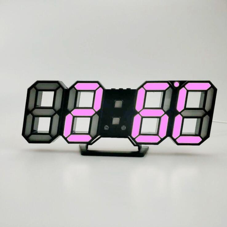 3D LED wall clock displaying pink digits on a stand