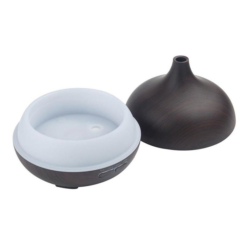 Aroma diffuser with the lid removed beside a closed unit, showing the water tank