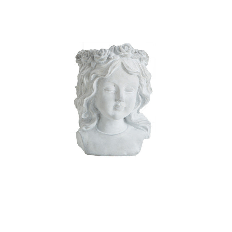 Cement bust planter of a girl with curled hair, front view
