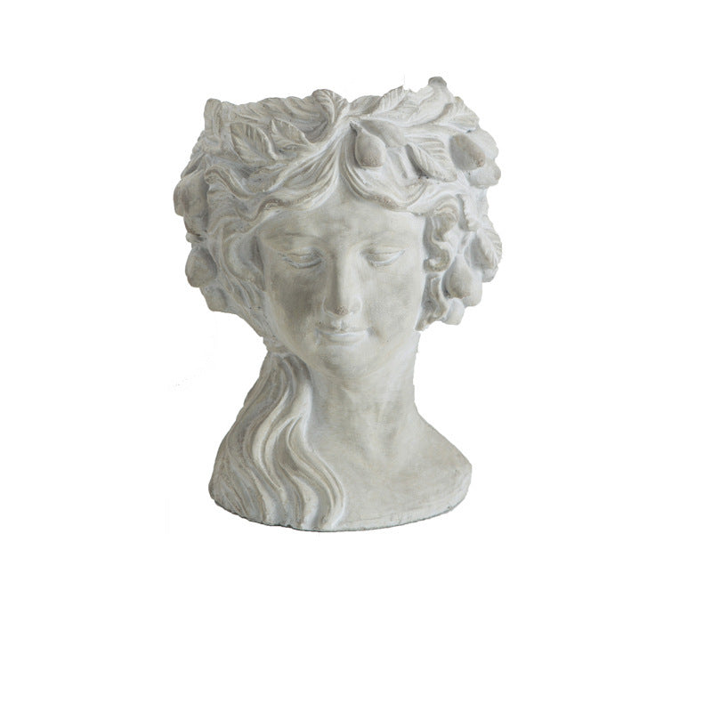 Cement bust planter of a woman with a rose crown, side view
