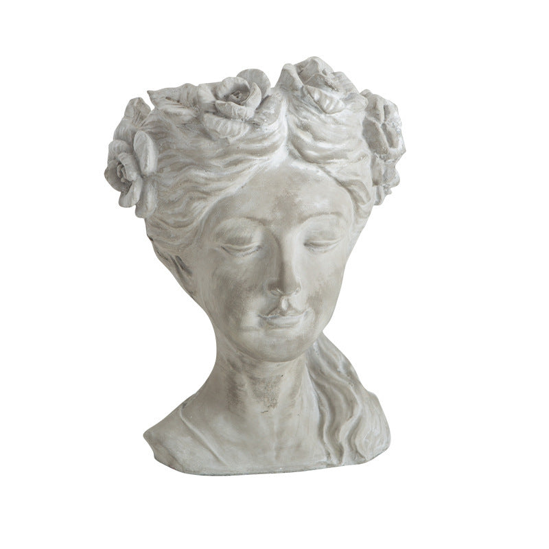 Cement bust planter of a woman with a rose crown, front view