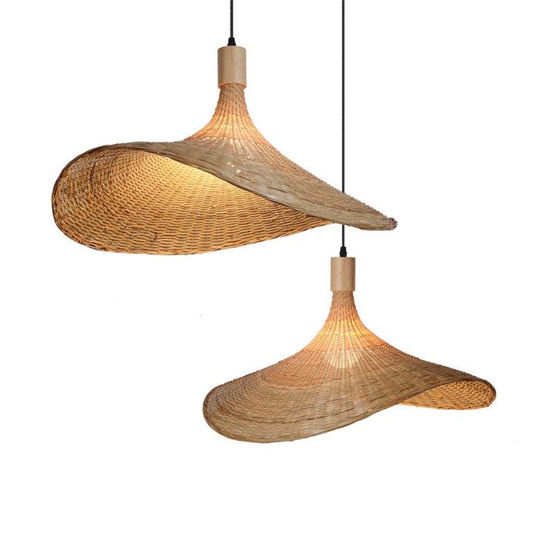 Two woven bamboo pendant shades, unlit, plain background
