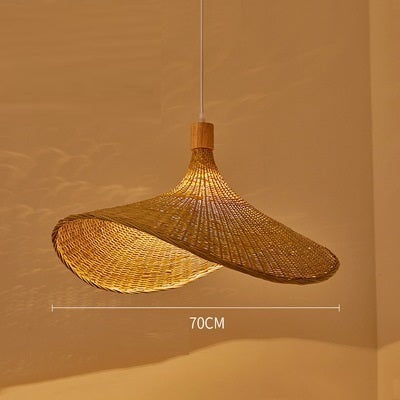 Woven bamboo pendant lit warm with its overall width marked