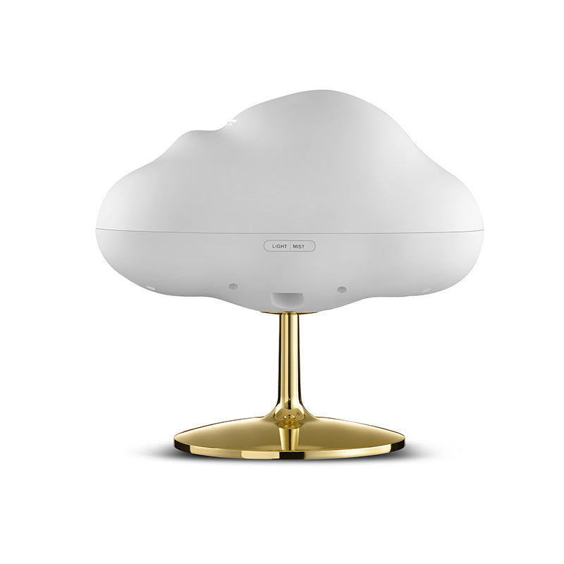 White cloud aroma diffuser on a gold stand, showing the control button