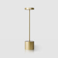 Gold cordless aluminium table lamp, plain background