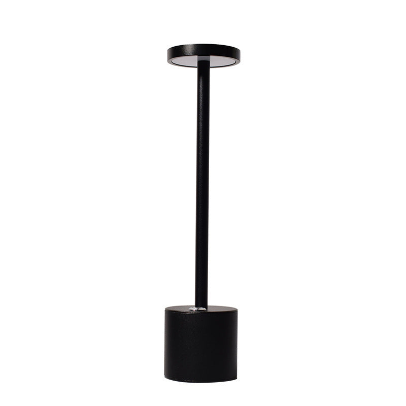 Black cordless aluminium table lamp, plain background