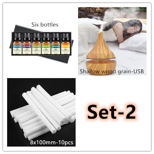 Shallow wood grain diffuser shown with six oil bottles and ten replacement wicks