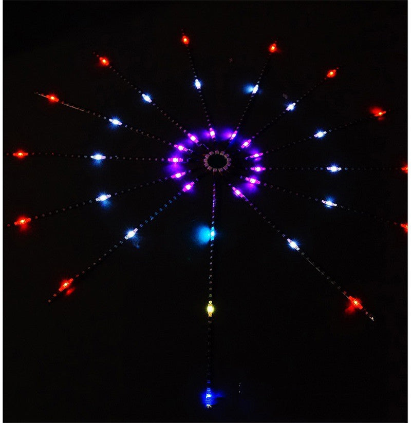 LED firework strip light mounted on a dark wall, lit in red, blue and purple