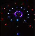 LED firework strip light mounted on a dark wall, lit in red, blue and purple