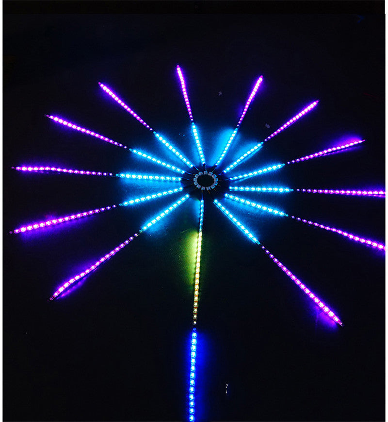 LED firework strip light lit in purple and blue on a dark wall