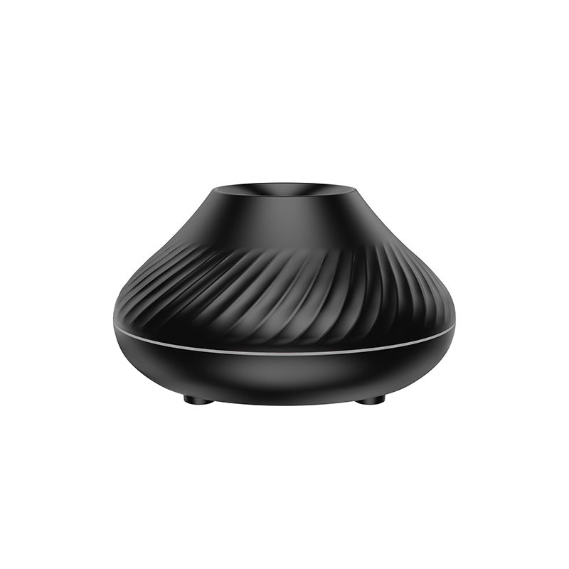 Black ribbed flame aroma diffuser, unlit, plain background