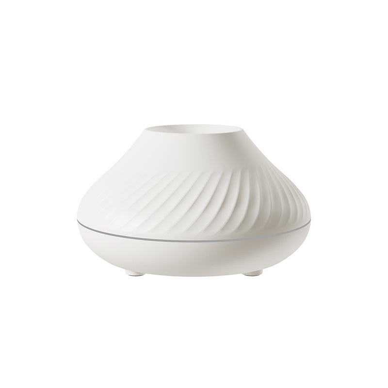 White ribbed flame aroma diffuser, unlit, plain background