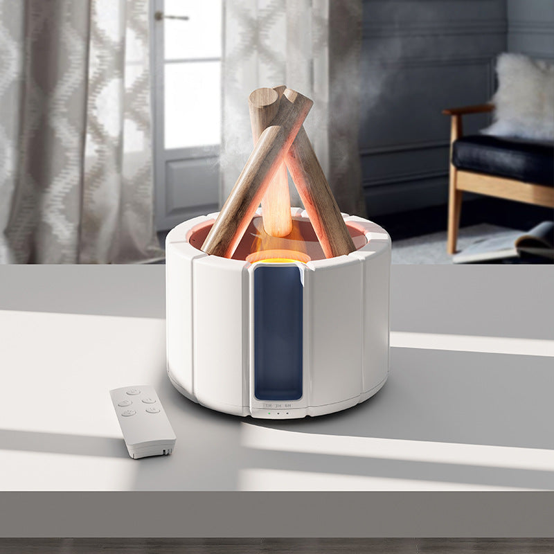 White campfire-style flame diffuser with its remote on a living room table