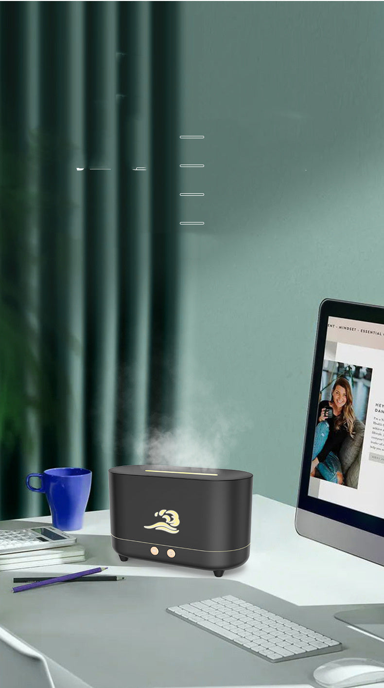 Dark flame aroma humidifier releasing mist on a desk beside a monitor