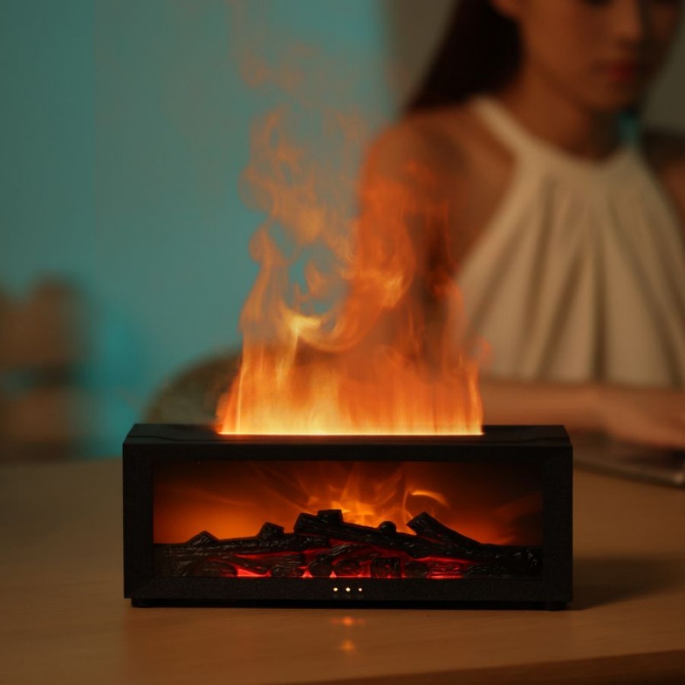 Black fireplace aroma diffuser with the flame effect lit on a side table