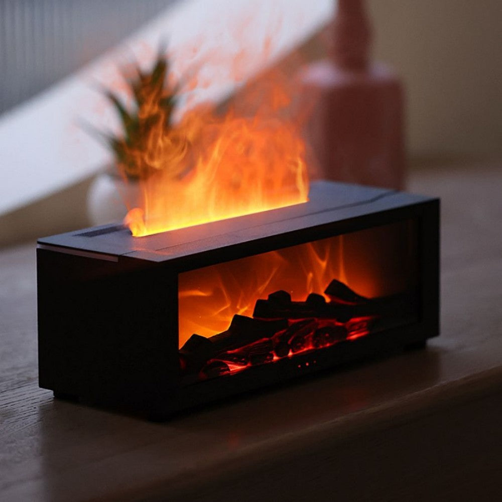 Fireplace aroma diffuser with the flame lit, a plant behind it