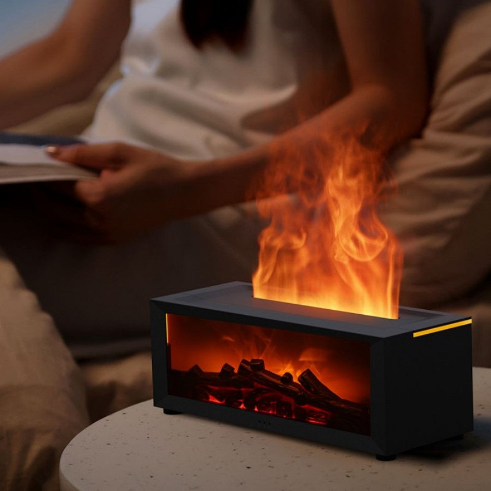 Fireplace aroma diffuser lit in front of a person sitting on a sofa