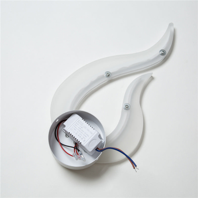 Back of the flame wall sconce showing the round mounting plate and wiring