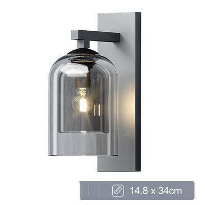 Smoke glass wall sconce lit, with its size marked on the image