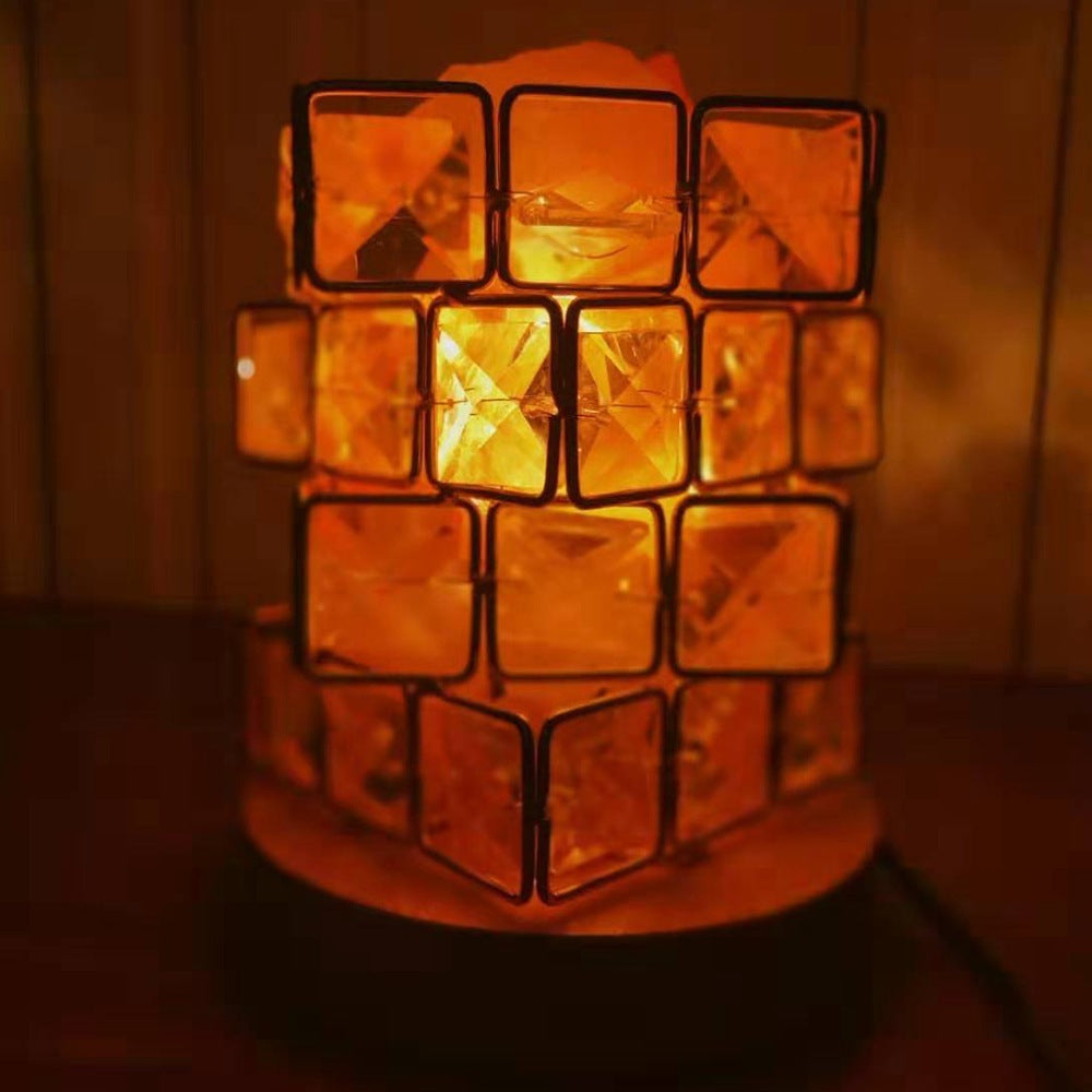 Close-up of the lit salt blocks glowing orange inside the crystal frame