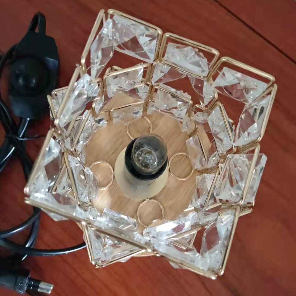 Top-down view of the crystal frame showing the bulb socket and power cable