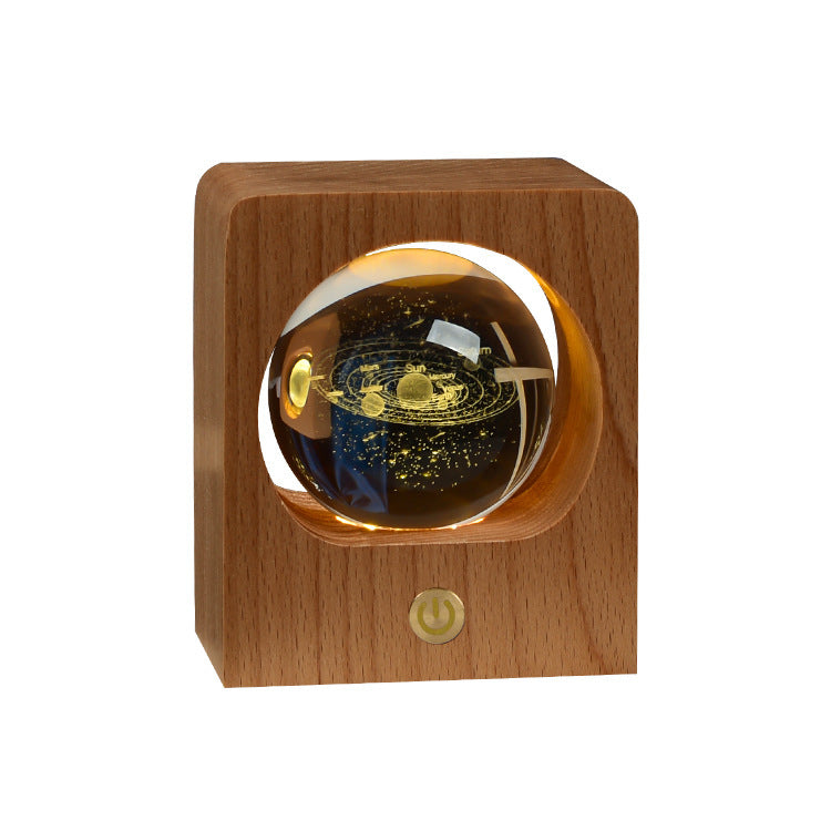 Square wooden frame night light with an engraved crystal ball, plain background