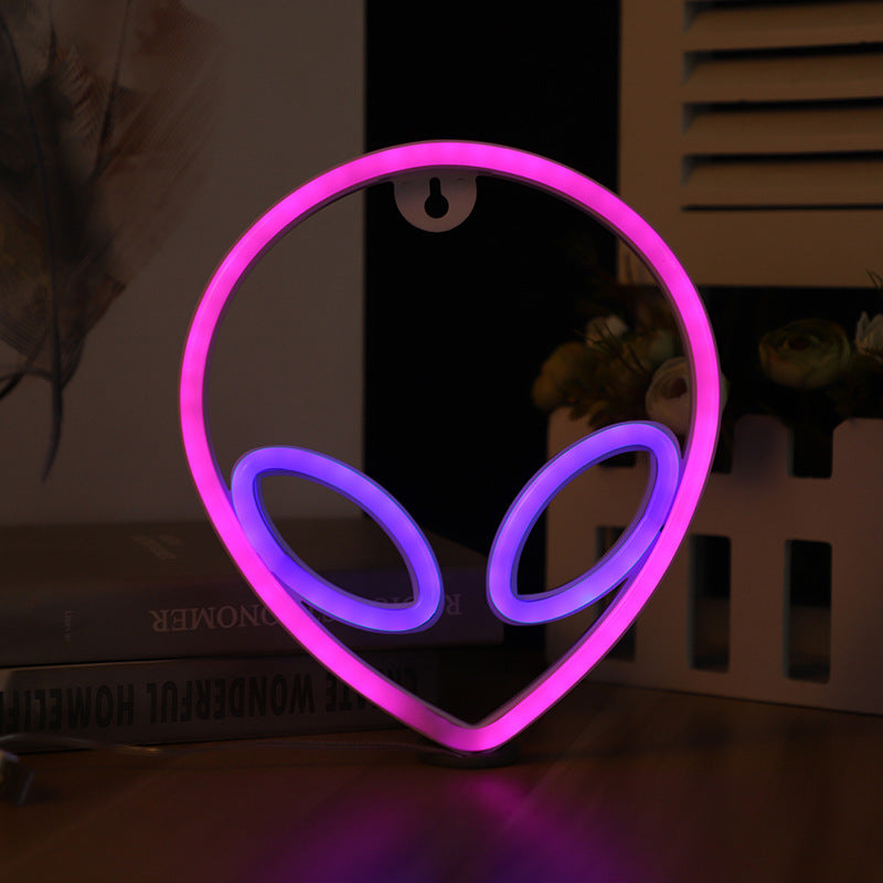 Neon wall sign in pink with purple eyes