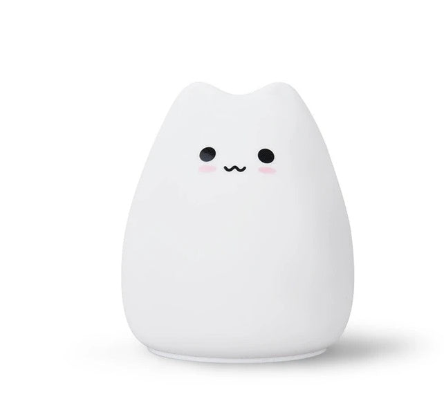 White silicone cat night light with a simple face, plain background