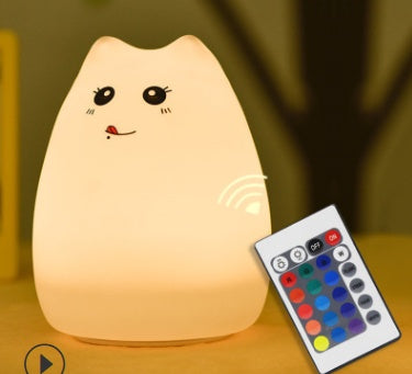 Silicone cat night light shown with its colour-changing remote control