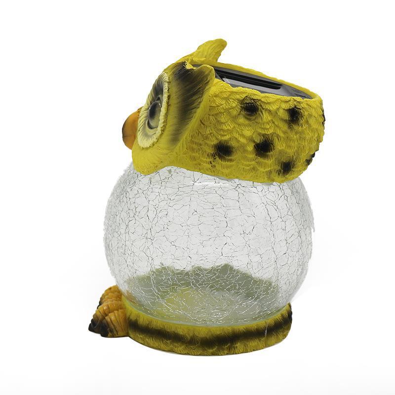 Owl solar garden light unlit, showing the crackle glass body, side view
