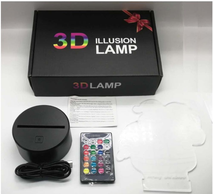 The 3D panda lamp shown with its box, base, remote control and cable