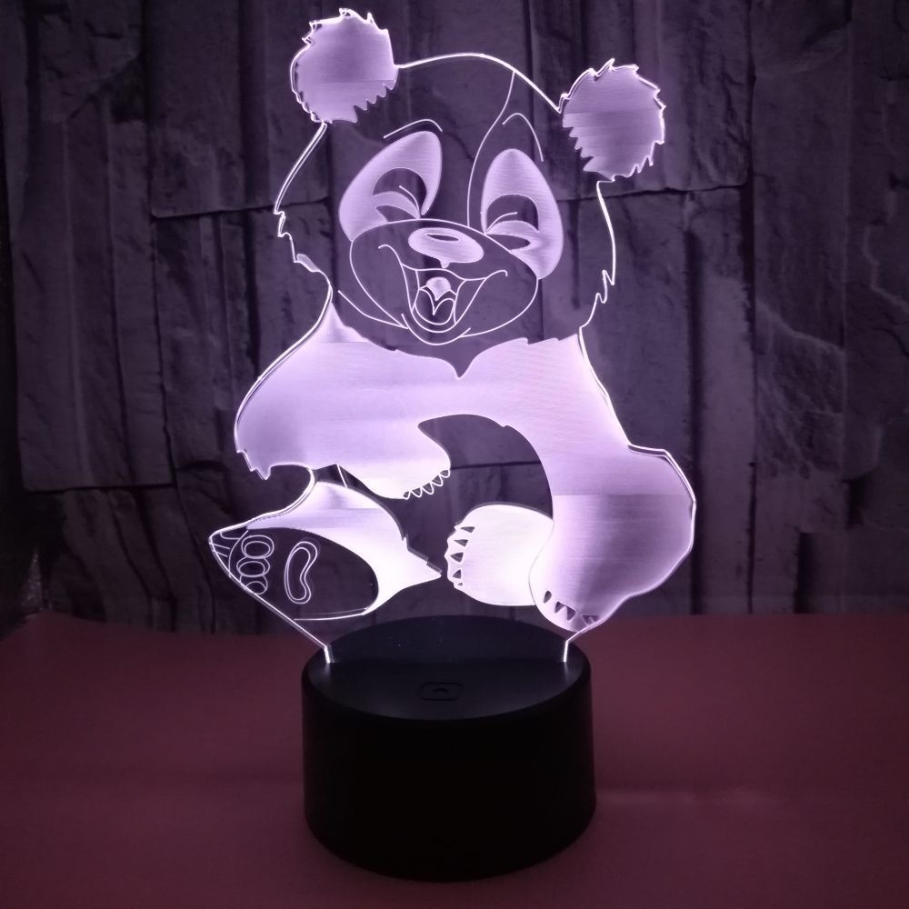 Acrylic 3D panda night light lit purple on a black base
