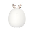 White silicone night light with rose gold antlers, plain background