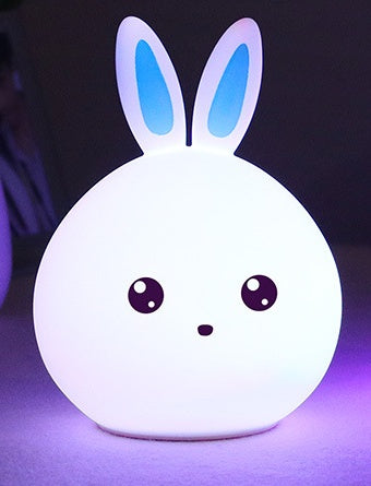 White silicone rabbit night light with blue ears, unlit body