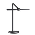 Black reading lamp with a horizontal head on a round base, plain background