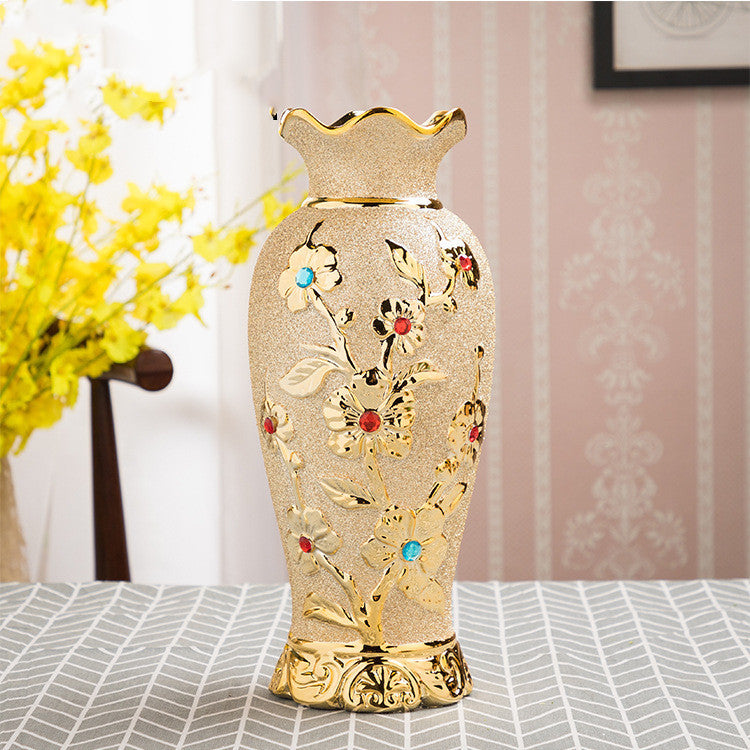 Tall ceramic vase with gold floral relief and inset coloured stones