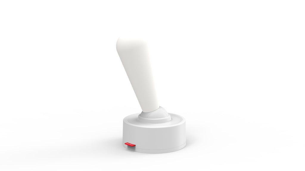 White cordless silicone wall light on its base, plain background
